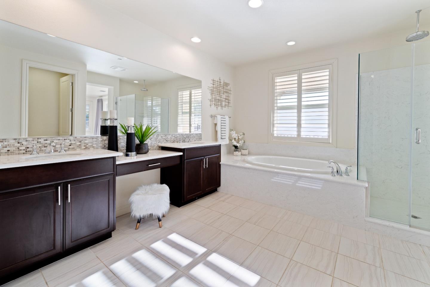 147 Elderberry Lane Brisbane, CA 94005 - Photo 29 of 56 a spacious bathroom with a double vanity sink a mirror and a bathtub