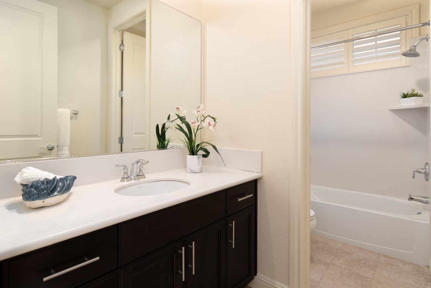 147 Elderberry Lane Brisbane, CA 94005 - Photo 36 of 56 a bathroom with a sink and a mirror