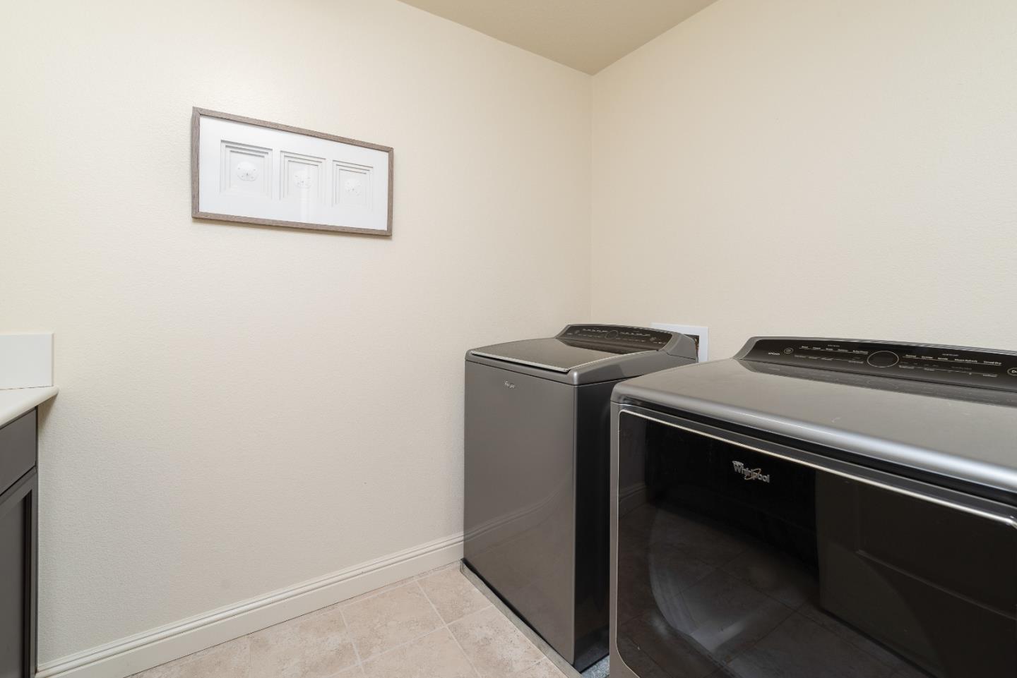 147 Elderberry Lane Brisbane, CA 94005 - Photo 40 of 56 a utility room with dryer and washer