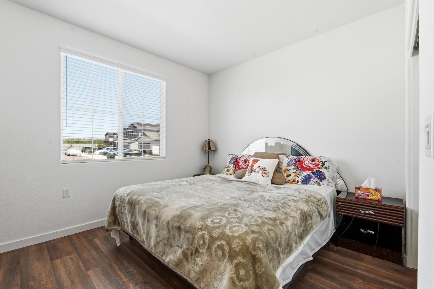 5713 Natalie Way Keyes, CA 95328 - Photo 22 of 30 a bedroom with a bed and a window