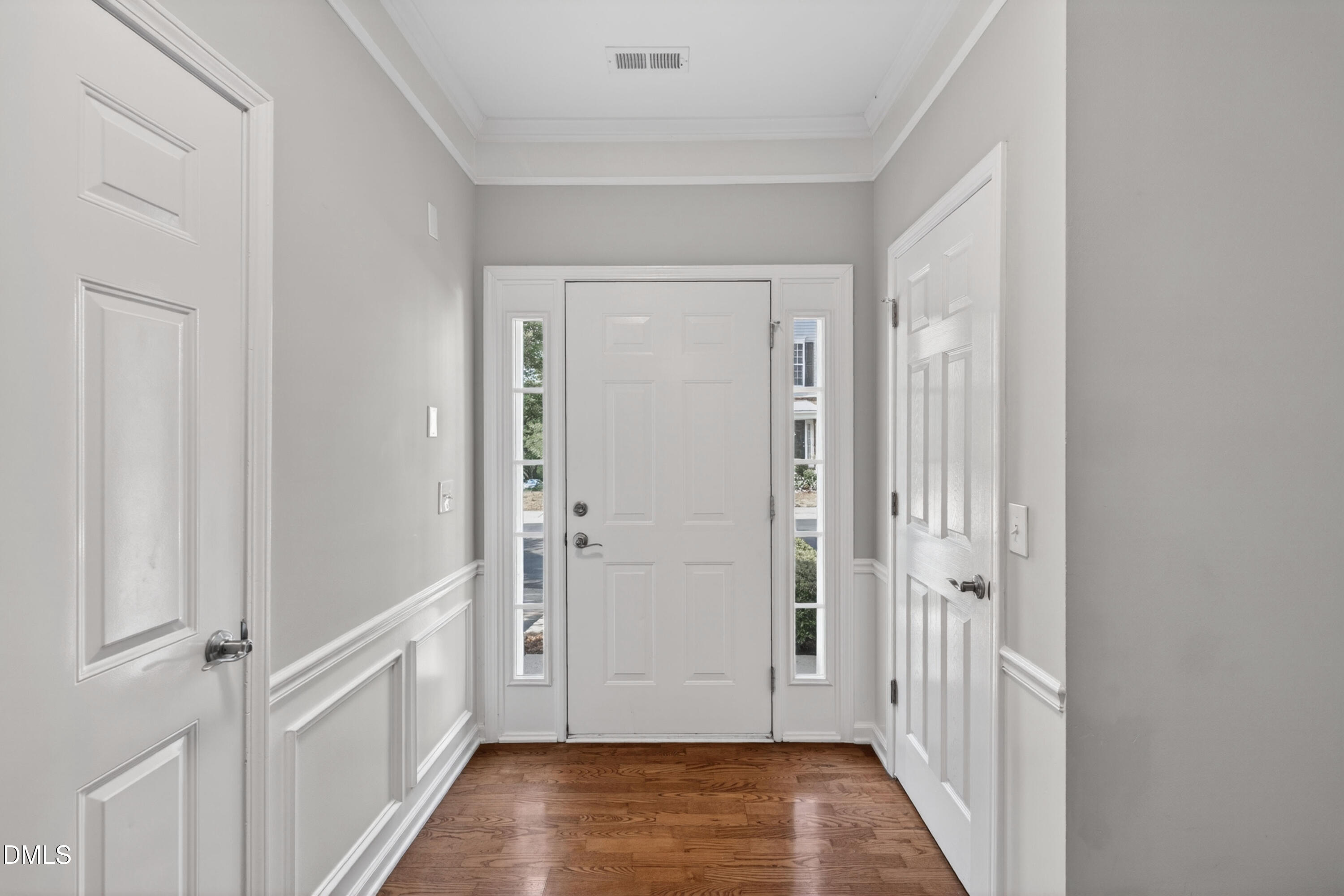 5421 Golden Arrow Lane Raleigh, NC 27613 - Photo 7 of 49 a view of a hallway with wooden floor and staircase