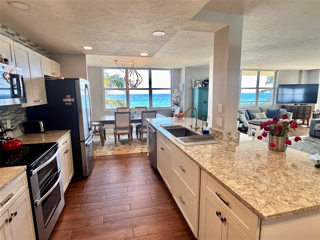 1147 Hillsboro Mile, Unit 214 Hillsboro Beach, FL 33062 - Photo 2 of 43 a kitchen with lots of counter top space