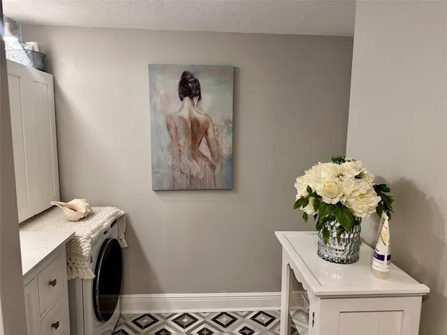 a bathroom with a sink mirror and vanity