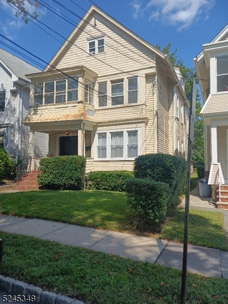 57 Maolis Avenue, Unit 2 Bloomfield, NJ 07003 - Photo 1 of 11 a front view of a house with a yard