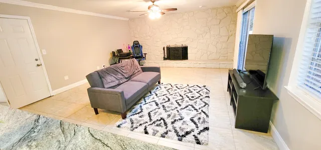a living room with a couch and a flat screen tv