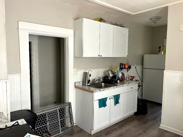 a kitchen with a stove and a refrigerator