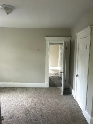 an empty room and closet area