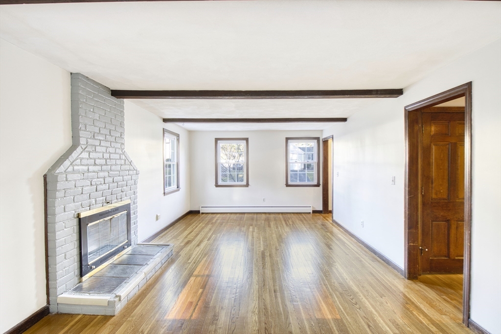 17 Colt Road Franklin, MA 02038 - Photo 11 of 40 an empty room with wooden floor and windows