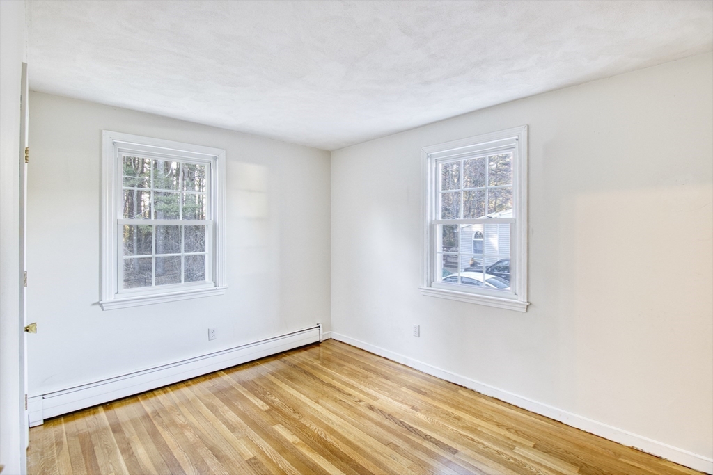 17 Colt Road Franklin, MA 02038 - Photo 15 of 40 a view of an empty room with wooden floor and a window