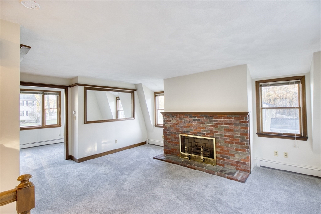17 Colt Road Franklin, MA 02038 - Photo 27 of 40 an empty room with windows and fireplace