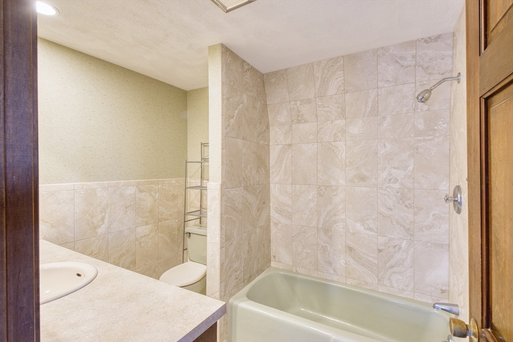 17 Colt Road Franklin, MA 02038 - Photo 32 of 40 a bathroom with a bathtub and a shower