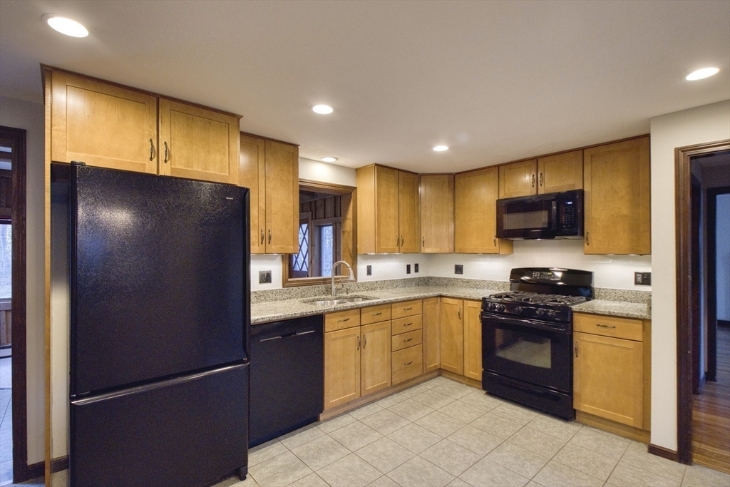 17 Colt Road Franklin, MA 02038 - Photo 6 of 40 a kitchen with stainless steel appliances granite countertop a stove a sink dishwasher a refrigerator and a microwave