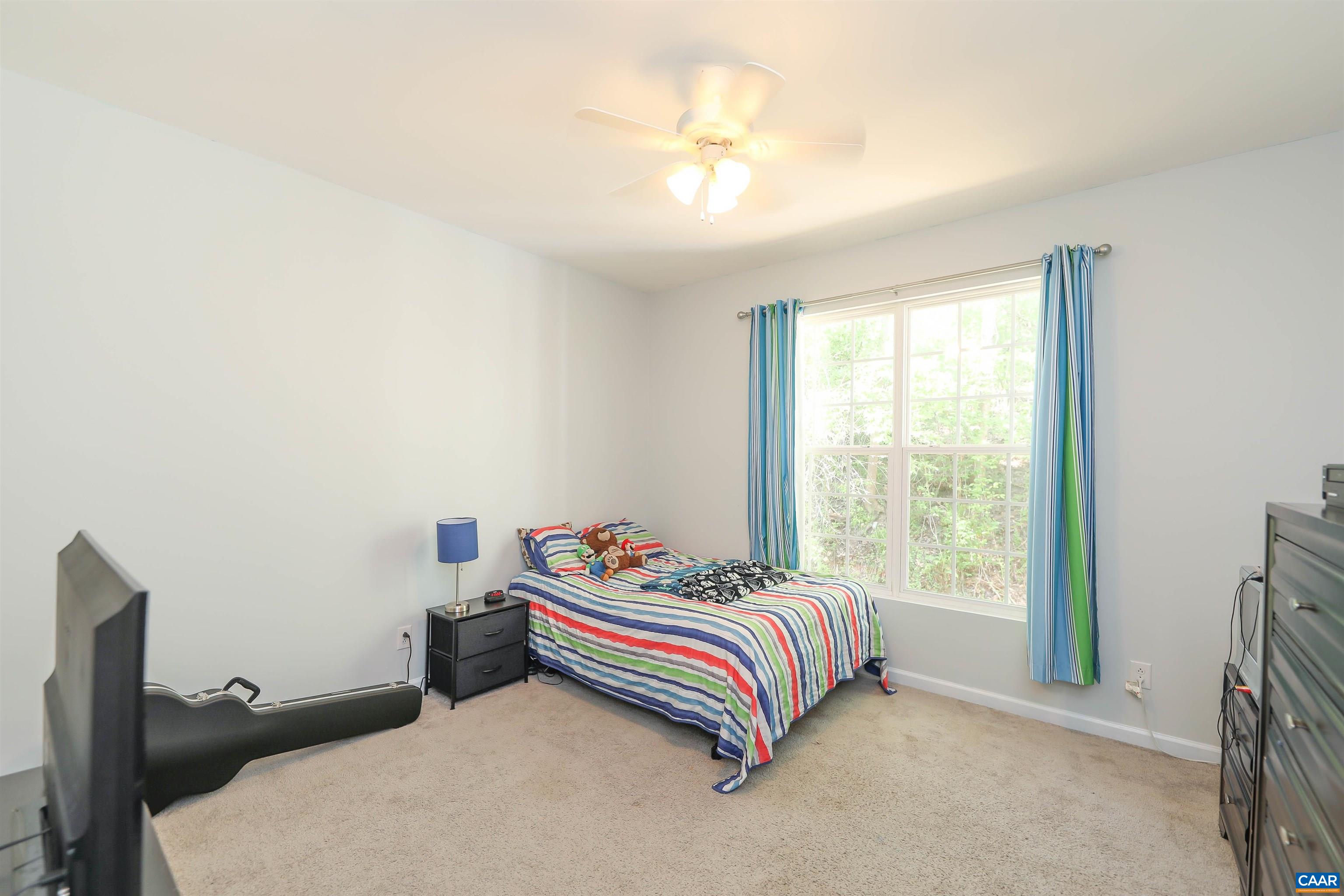 286 Snapdragon Road Ruckersville, VA 22968 - Photo 34 of 44 a bedroom with a bed and a window