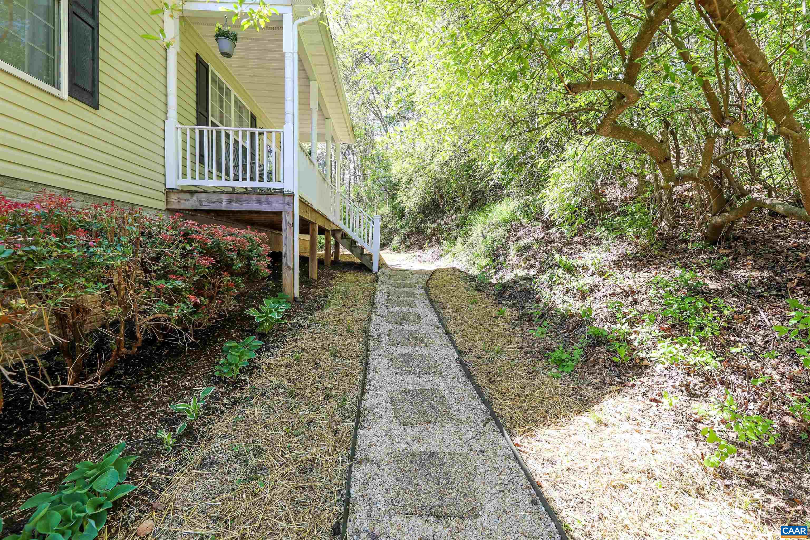 286 Snapdragon Road Ruckersville, VA 22968 - Photo 4 of 44 a pathway of a house with a yard