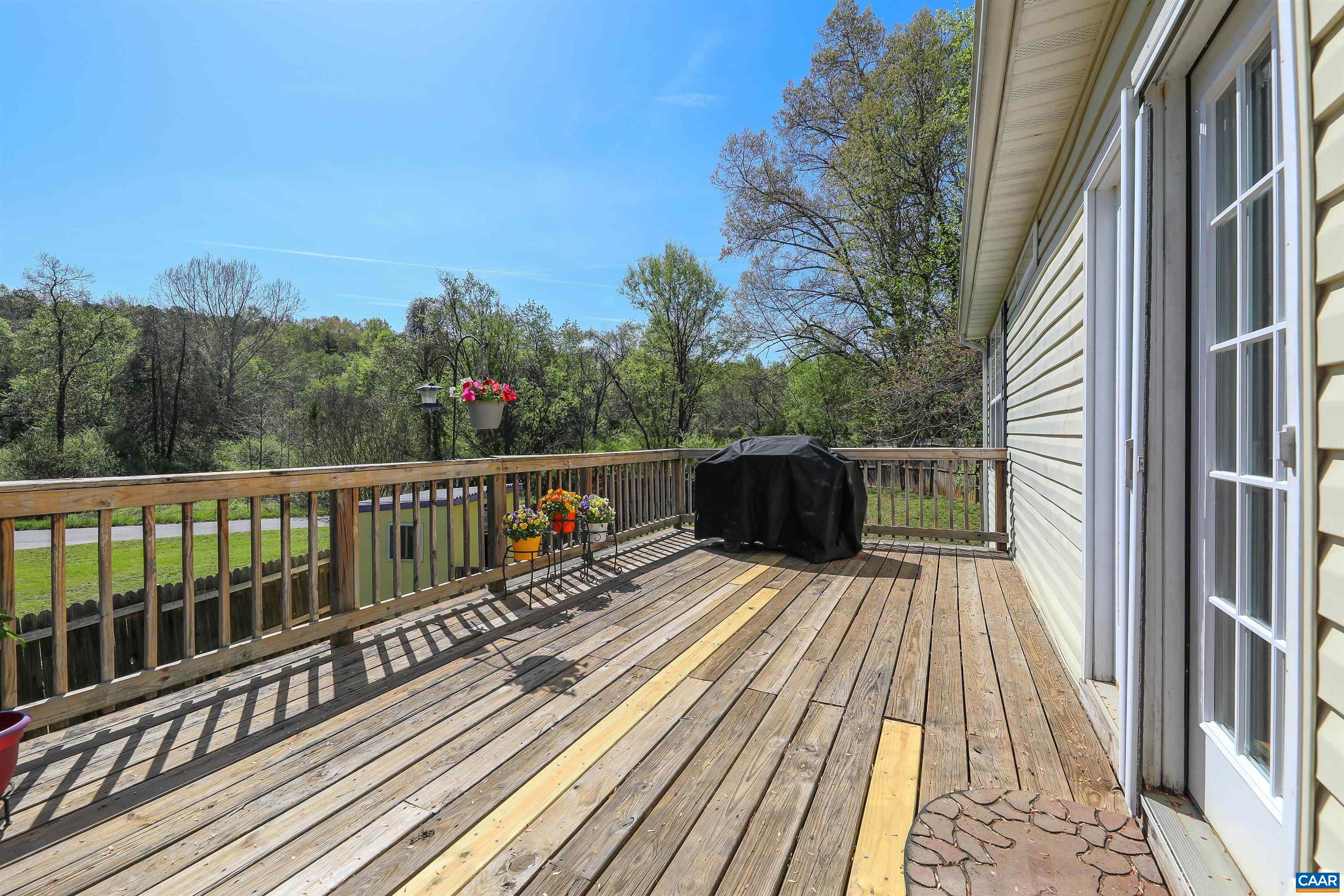 286 Snapdragon Road Ruckersville, VA 22968 - Photo 8 of 44 a view of balcony with wooden floor and fence