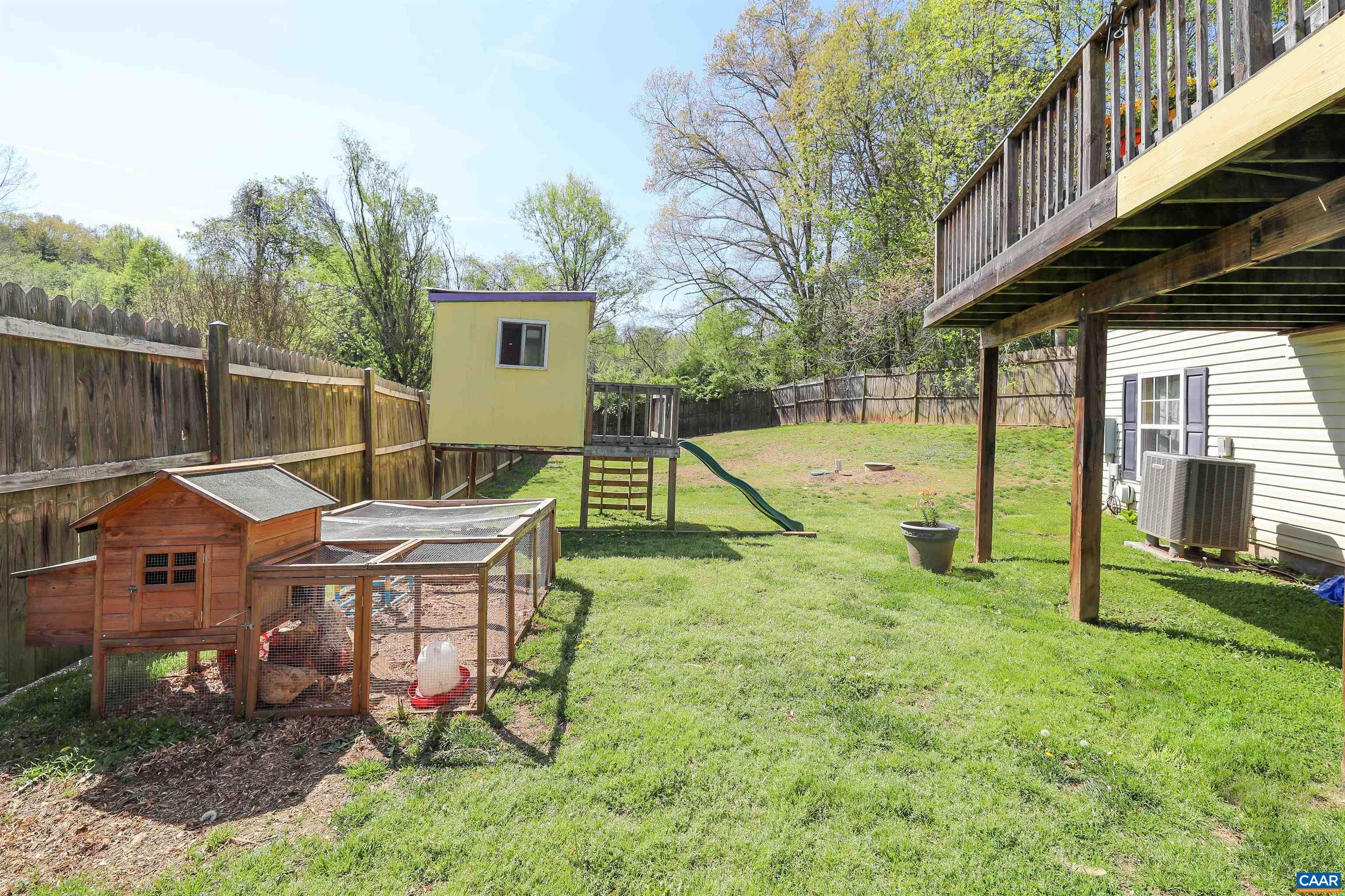 286 Snapdragon Road Ruckersville, VA 22968 - Photo 9 of 44 a view of a house with backyard and a slide