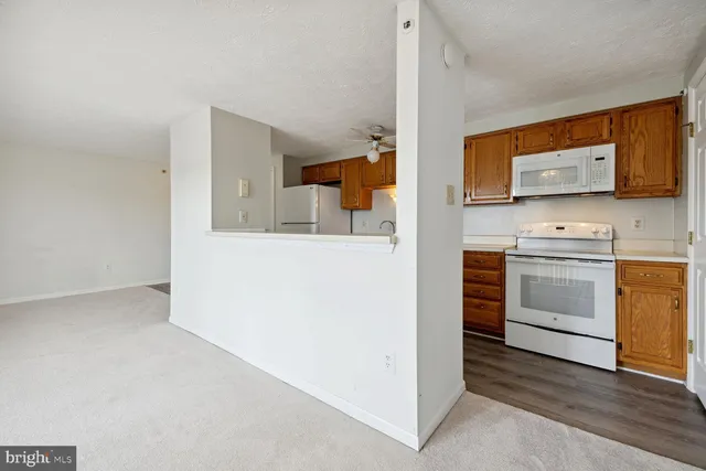 a kitchen with a stove and a microwave