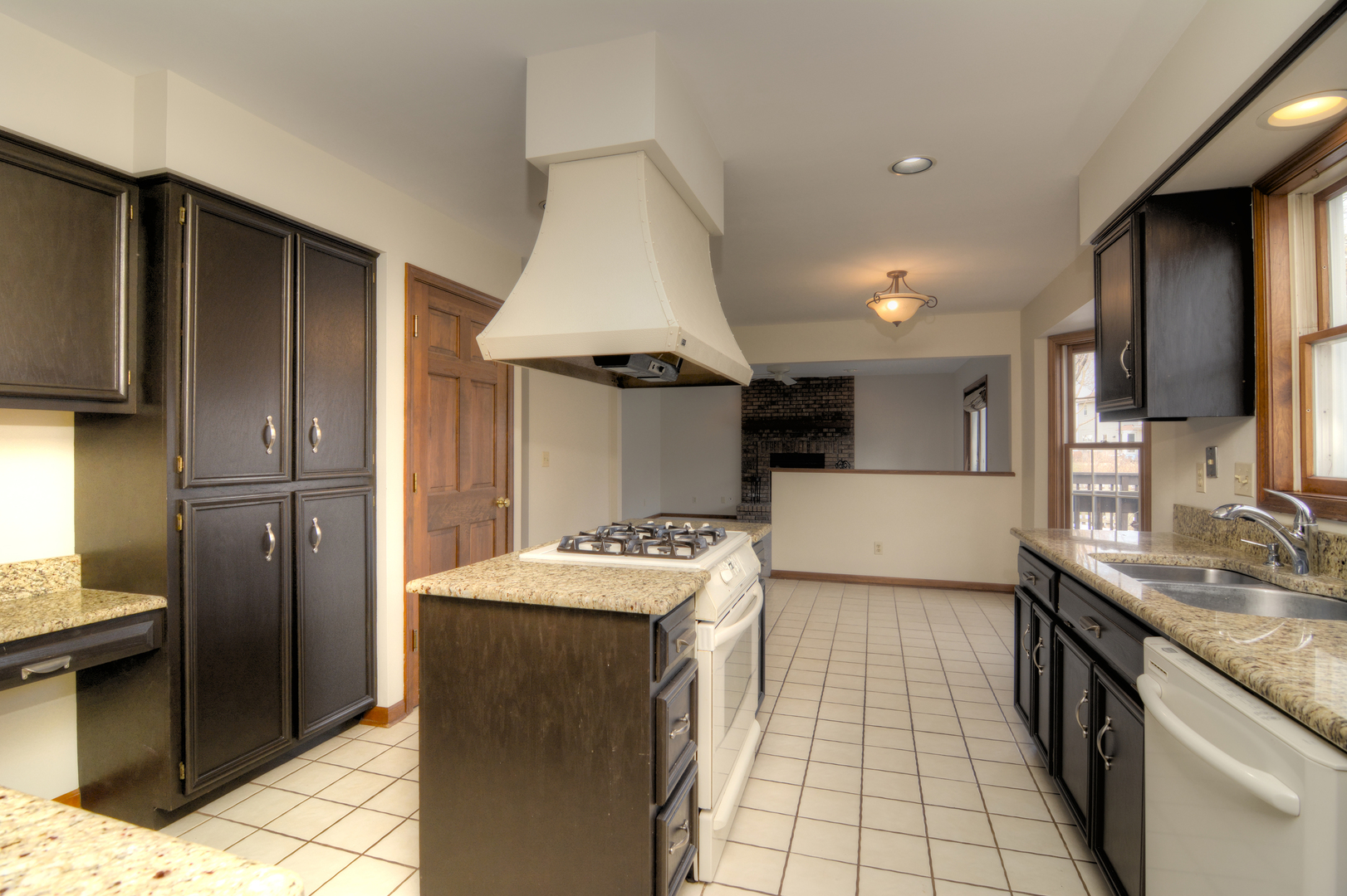 1950 Huntington Road St. Charles, IL 60174 - Photo 11 of 26 a kitchen with a sink refrigerator and cabinets