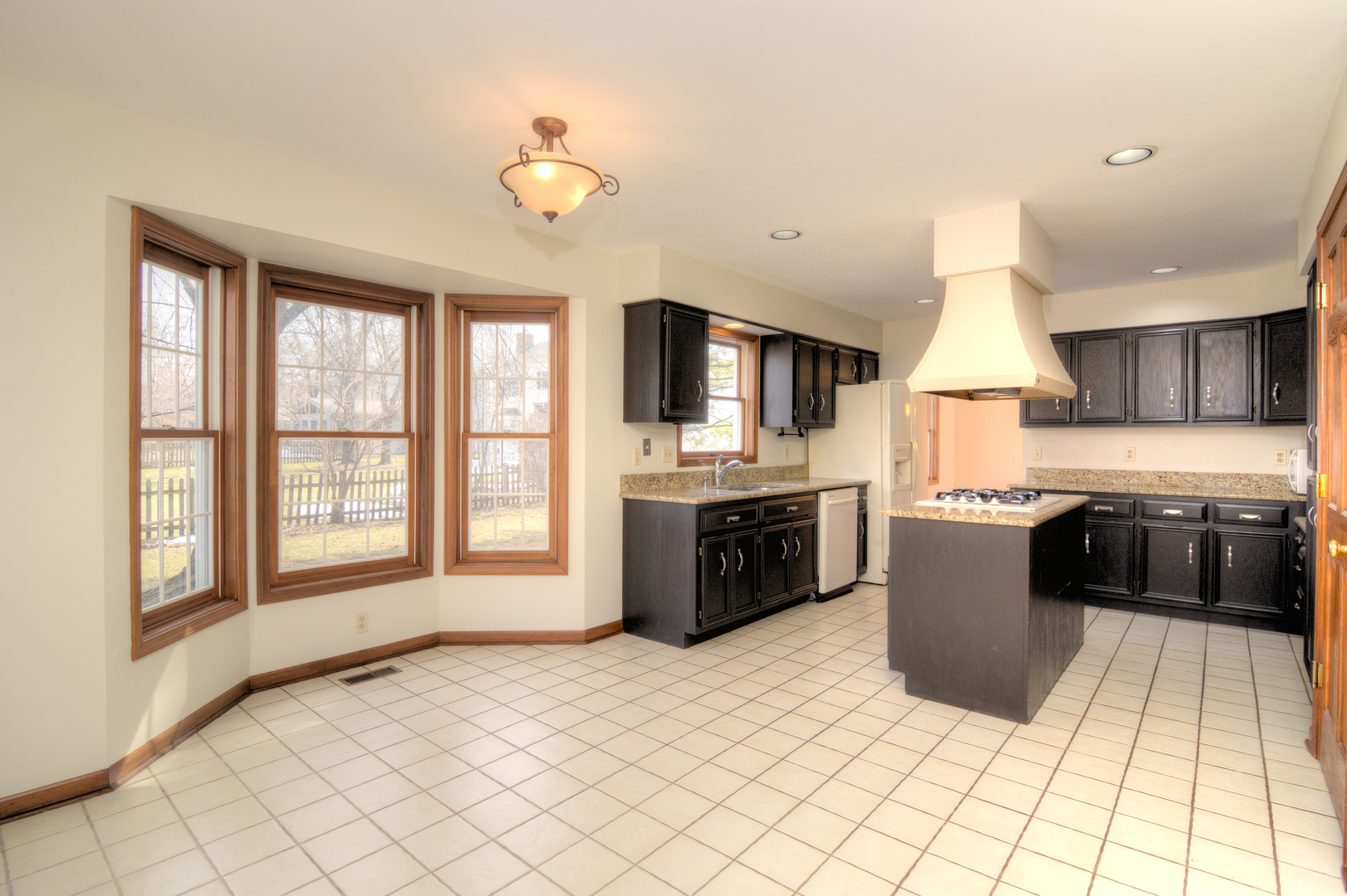1950 Huntington Road St. Charles, IL 60174 - Photo 13 of 26 a kitchen with stainless steel appliances granite countertop a stove top oven a sink a counter space and cabinets