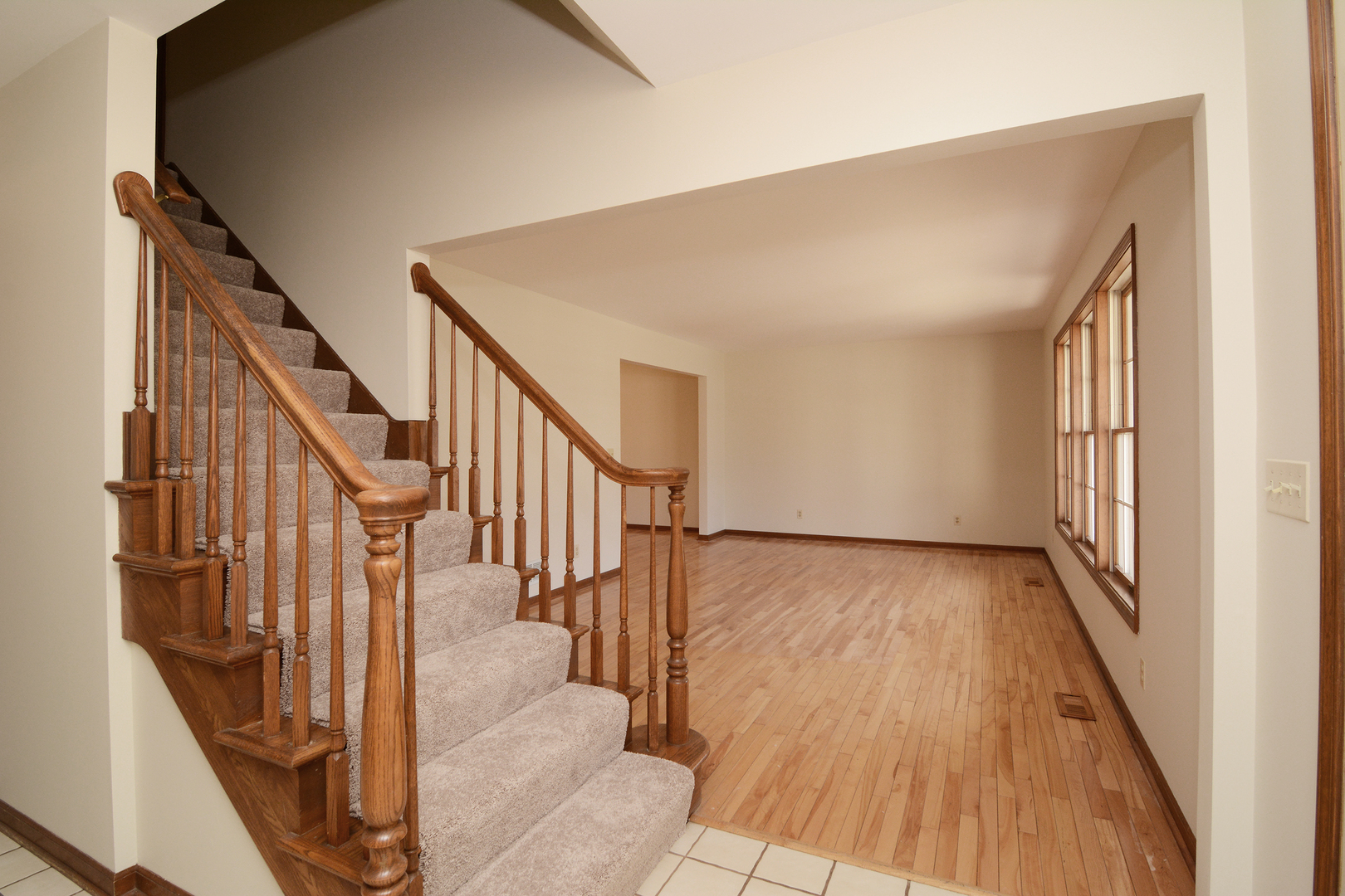 1950 Huntington Road St. Charles, IL 60174 - Photo 3 of 26 a view of an entryway with wooden floor and door