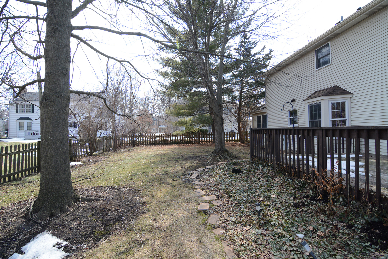 1950 Huntington Road St. Charles, IL 60174 - Photo 25 of 26 a view of a yard with wooden fence and large trees