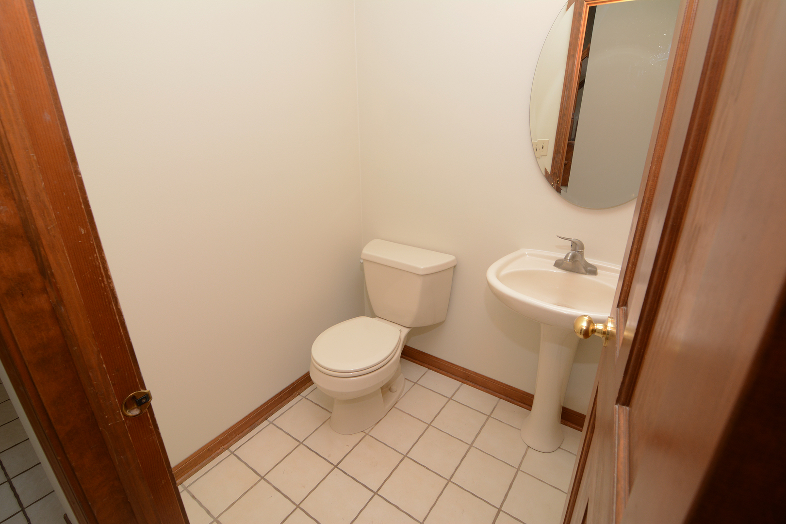 1950 Huntington Road St. Charles, IL 60174 - Photo 4 of 26 a white toilet sitting next to a sink and vanity
