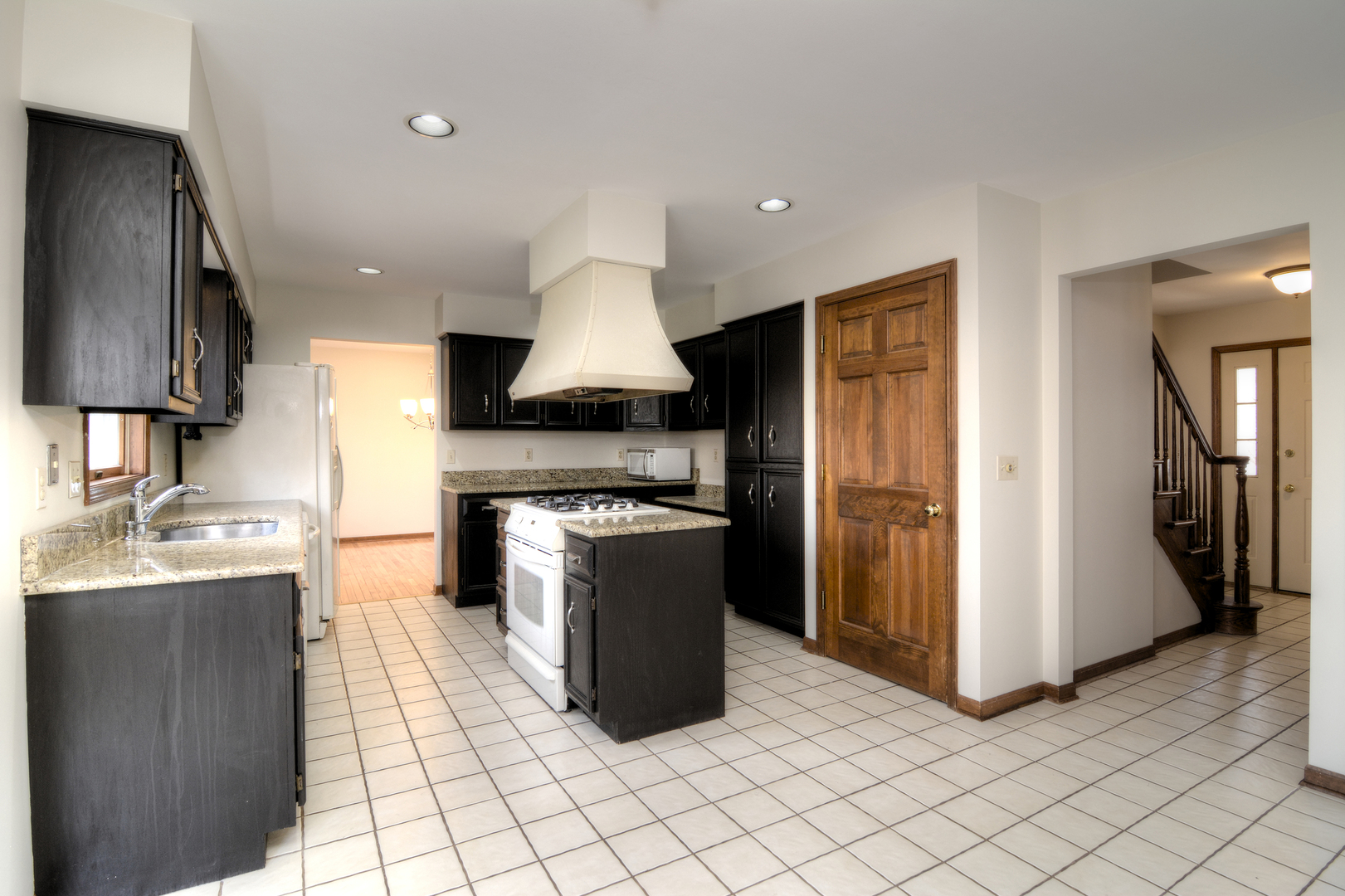 1950 Huntington Road St. Charles, IL 60174 - Photo 9 of 26 a kitchen with stainless steel appliances granite countertop a refrigerator a sink and a stove