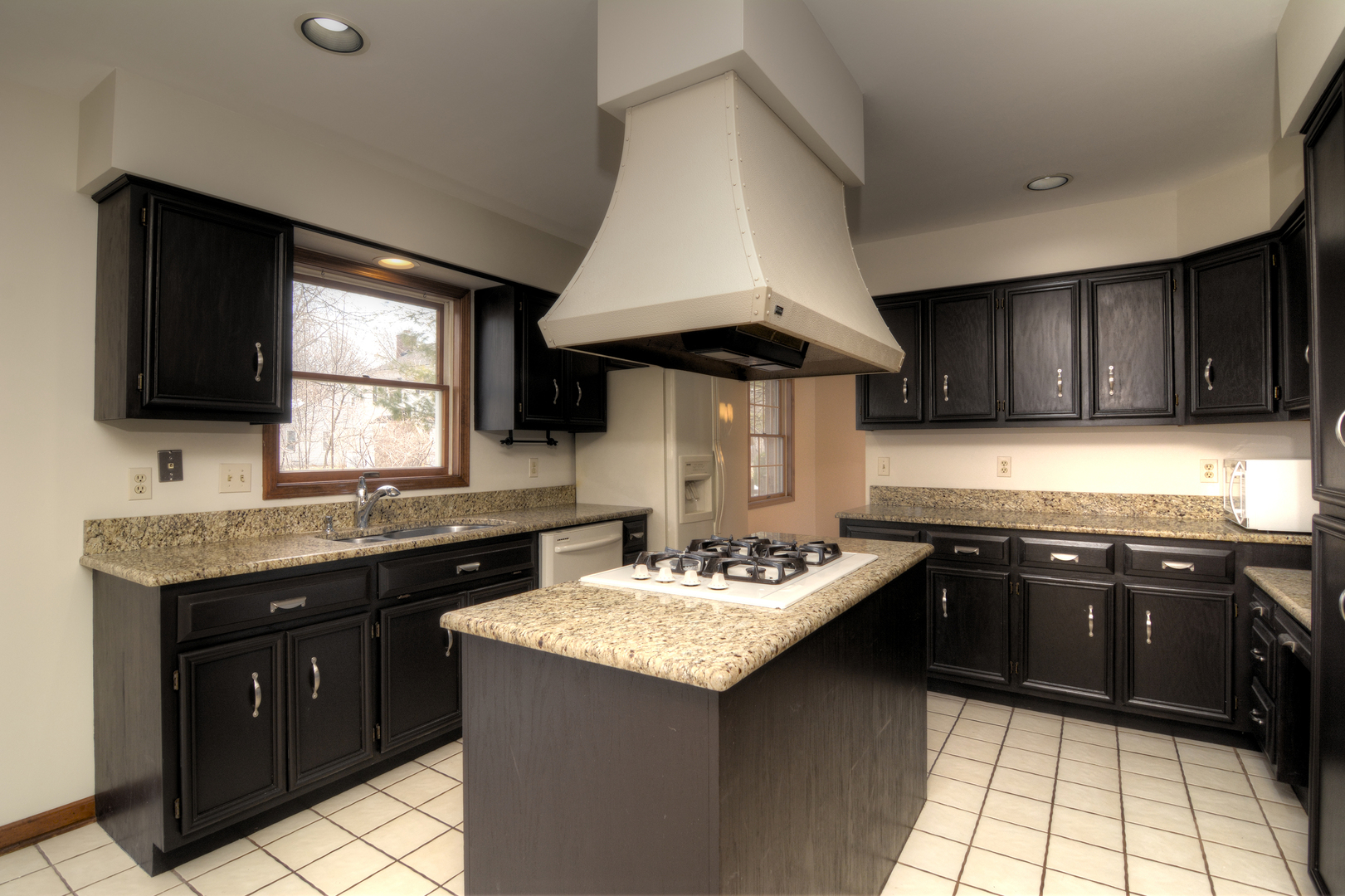 1950 Huntington Road St. Charles, IL 60174 - Photo 10 of 26 a kitchen with a sink stove and cabinets
