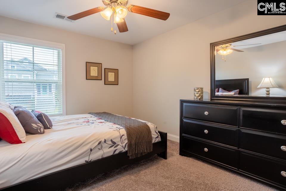 357 Cabana Way Lexington, SC 29072 - Photo 15 of 25 a bedroom with a bed and a dresser