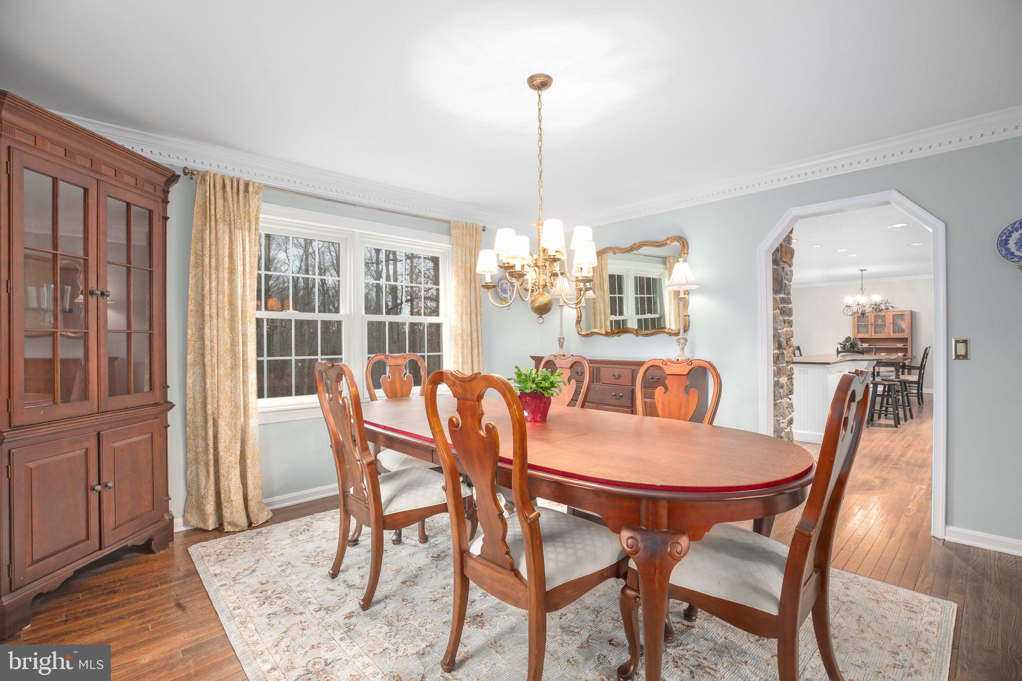 9 Old Ridge Road Fredericksburg, VA 22407 - Photo 13 of 110 a dining room with furniture a chandelier and wooden floor