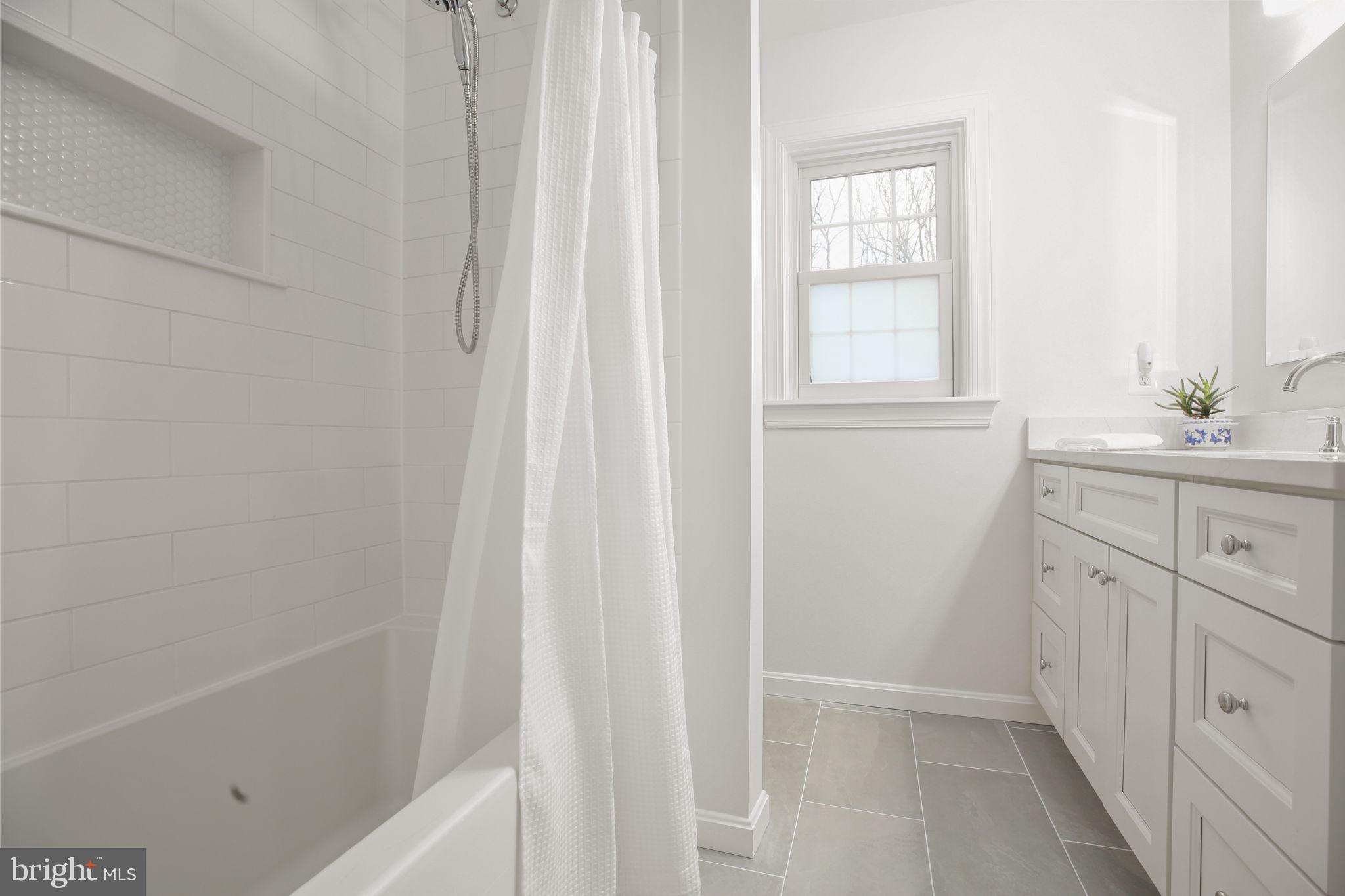 9 Old Ridge Road Fredericksburg, VA 22407 - Photo 34 of 110 a bathroom with a bathtub a sink and a window