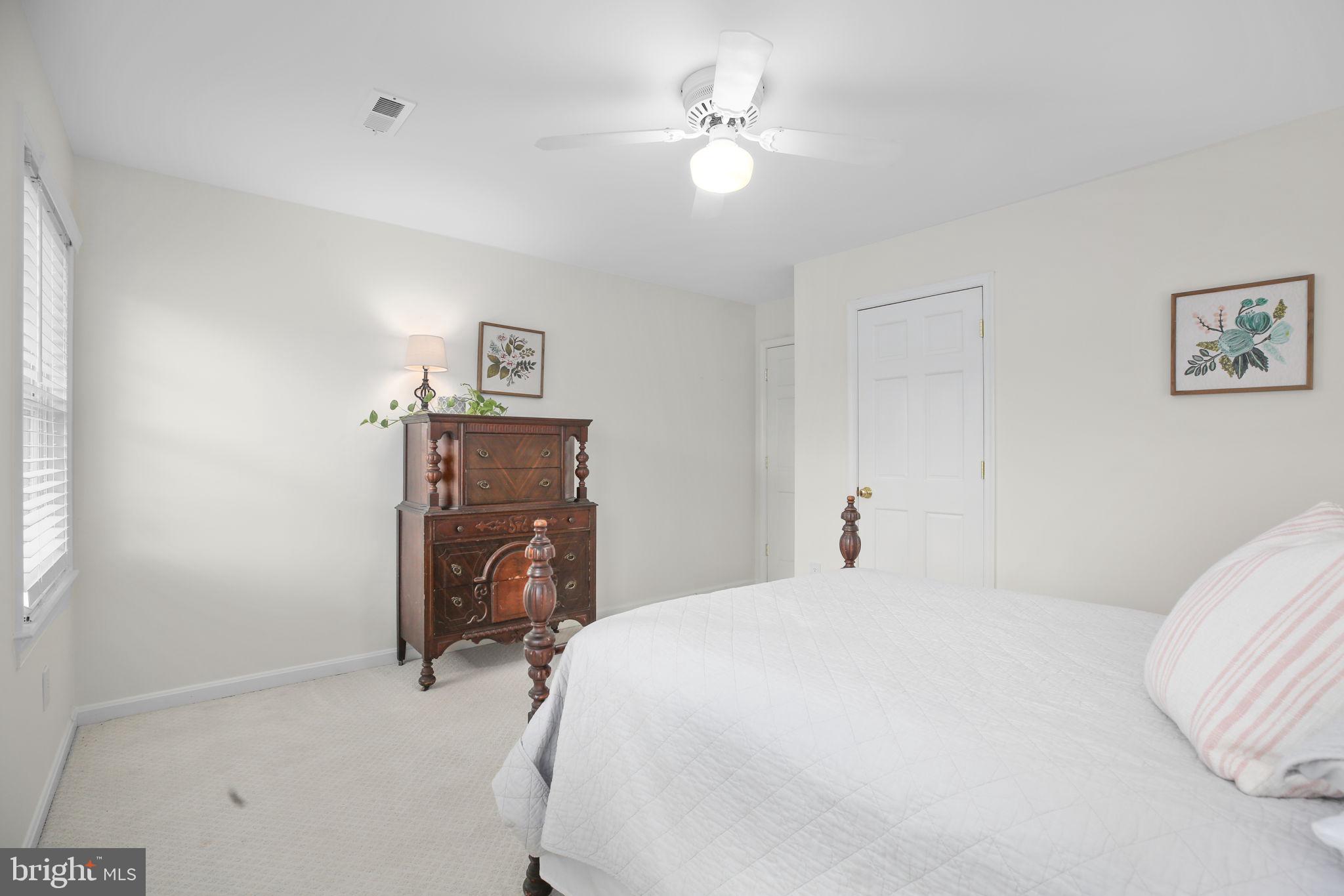 9 Old Ridge Road Fredericksburg, VA 22407 - Photo 44 of 110 a bedroom with a bed and a chandelier