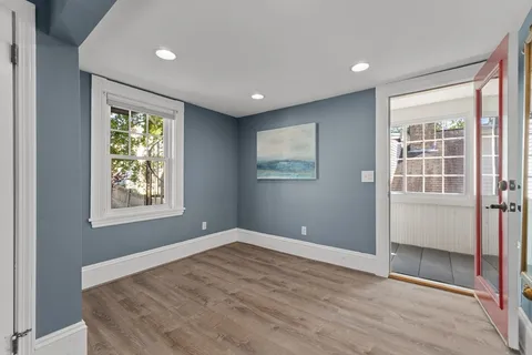 a view of a bathroom with wooden floor