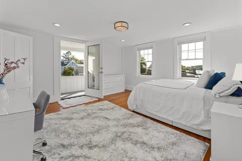 a view of an entryway with wooden floor