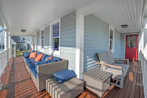 a outdoor living space with furniture and a fireplace