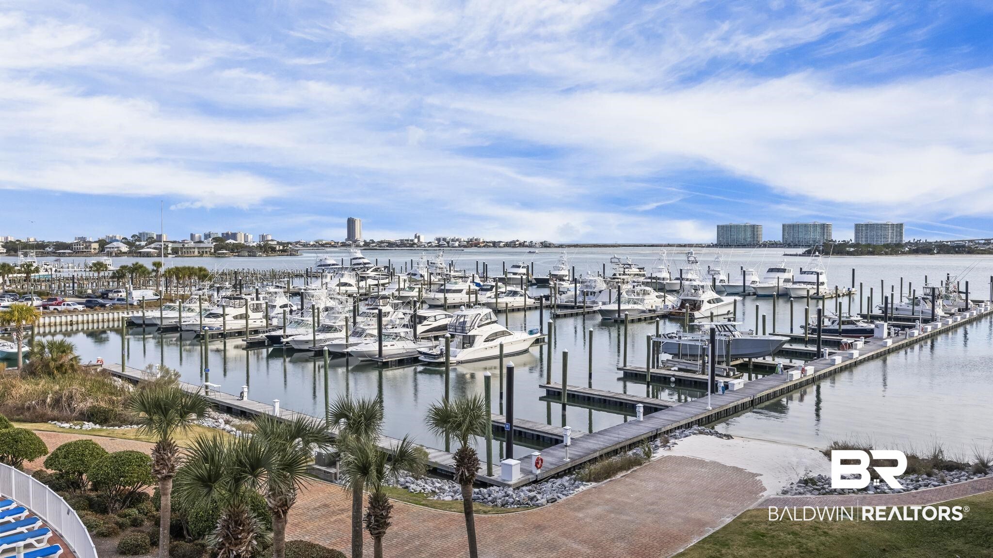 27800 Canal Road, Unit 313 Orange Beach, AL 36561 - Photo 15 of 23 Expansive marina featuring multiple boat slips and a wide waterway