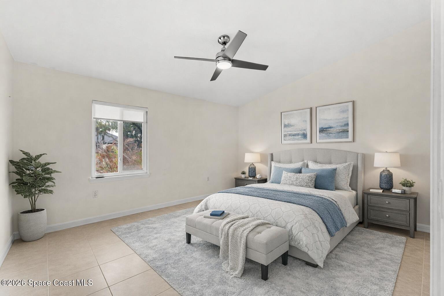 3070 Rio Plumosa North Indialantic, FL 32903 - Photo 20 of 29 a bedroom with a bed and a potted plant