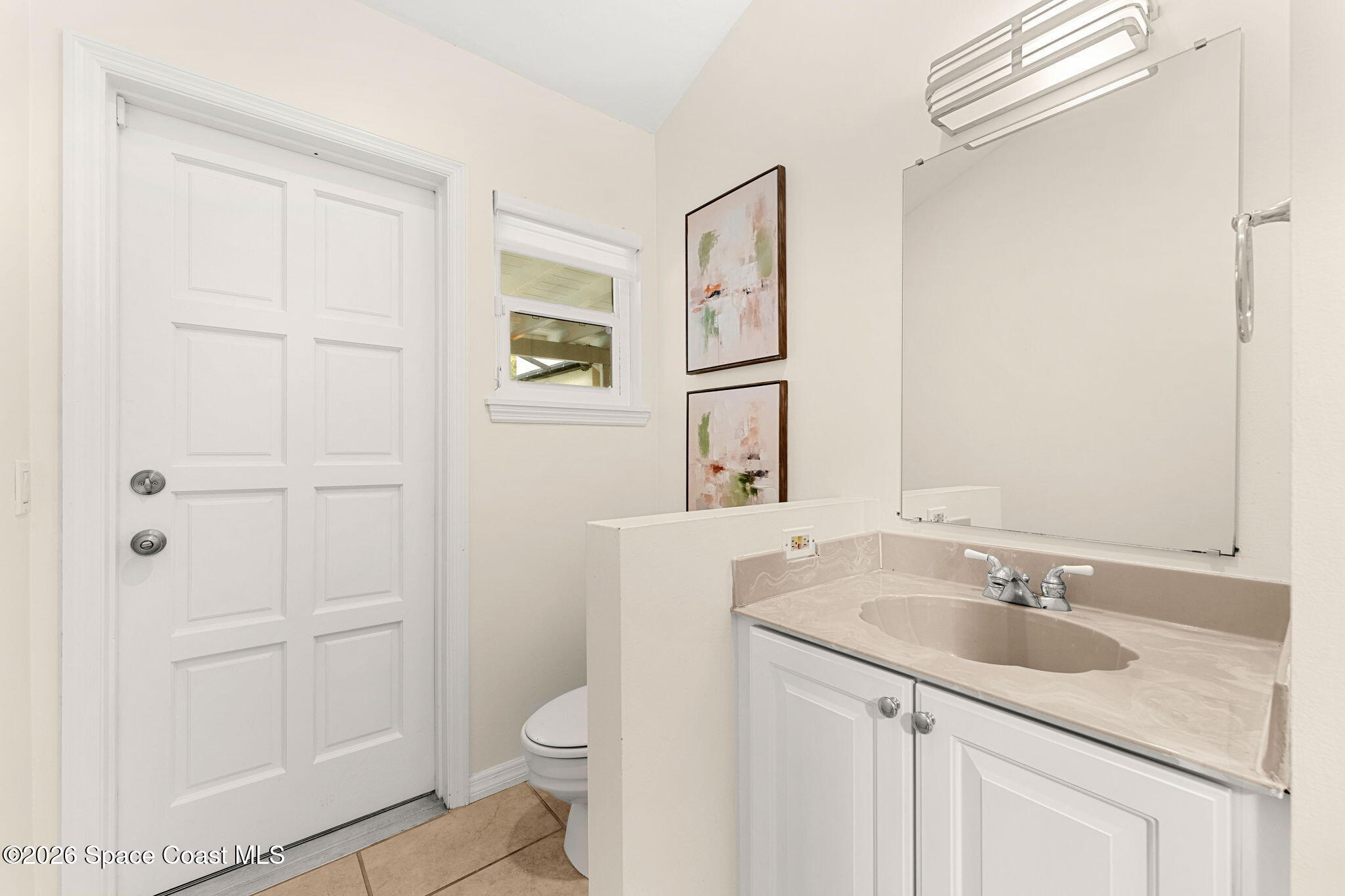 3070 Rio Plumosa North Indialantic, FL 32903 - Photo 21 of 29 a bathroom with a sink toilet and vanity