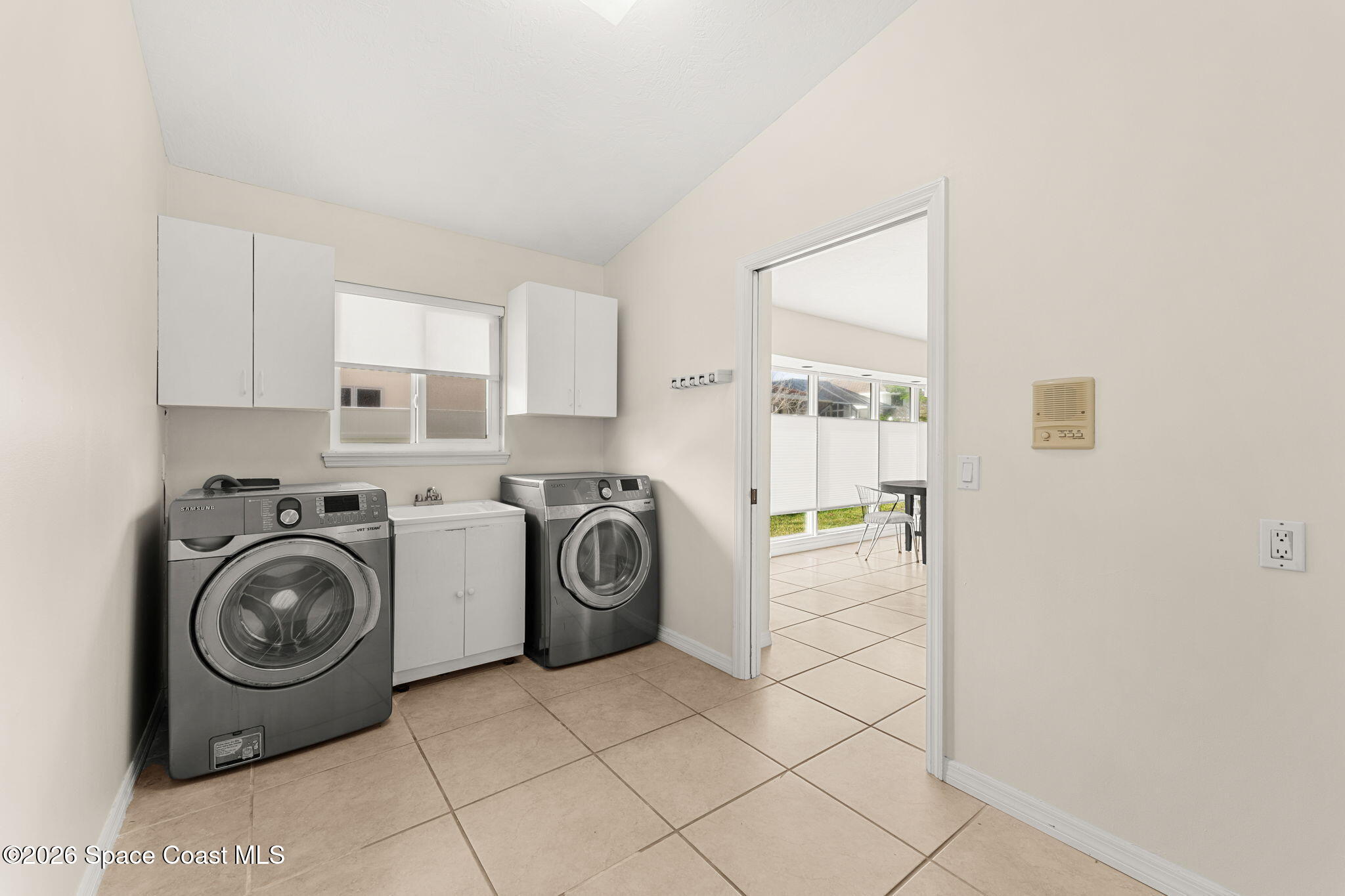 3070 Rio Plumosa North Indialantic, FL 32903 - Photo 22 of 29 a utility room with sink dryer and washer