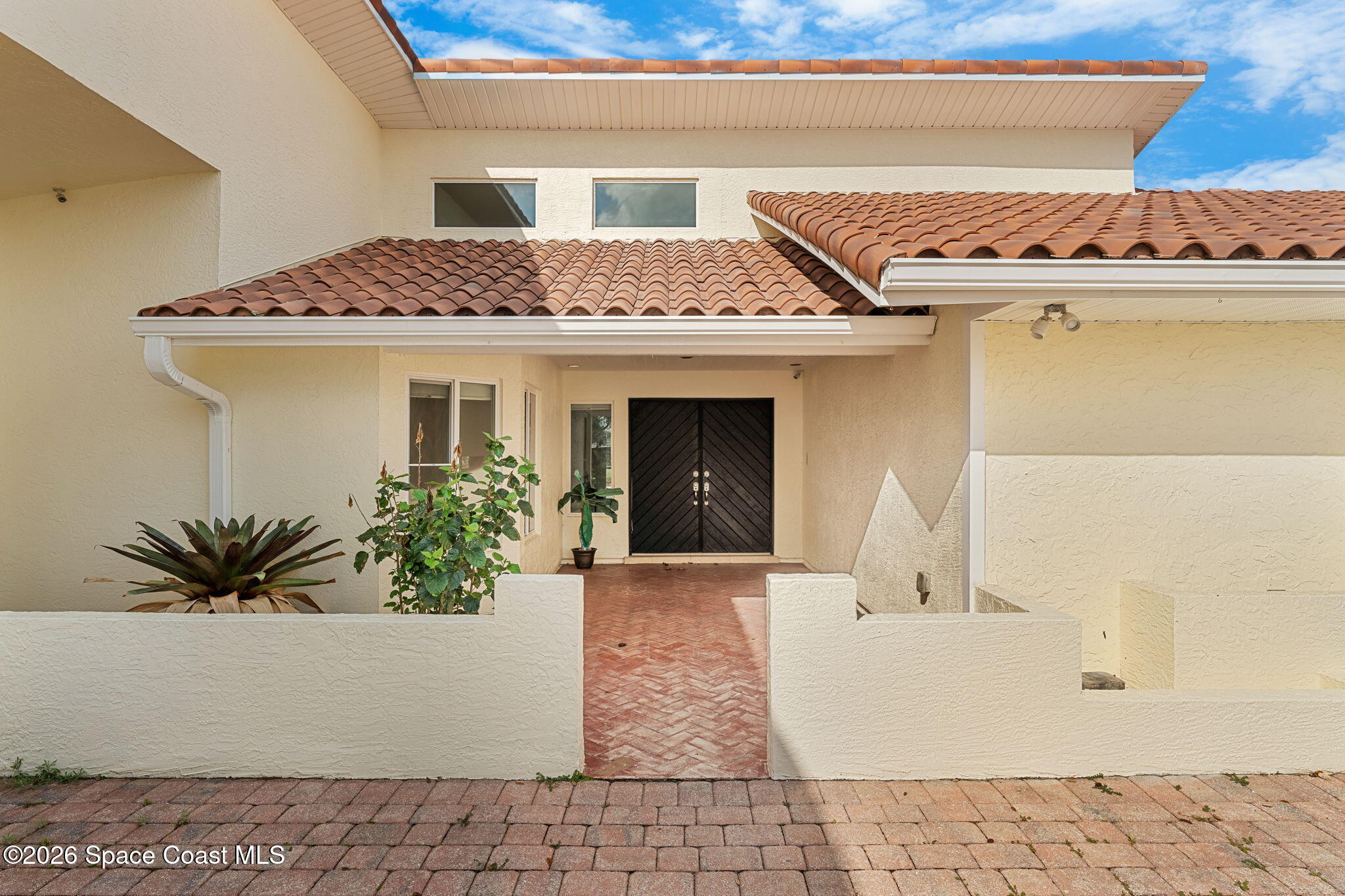 3070 Rio Plumosa North Indialantic, FL 32903 - Photo 26 of 29 a front view of a house with a potted plant