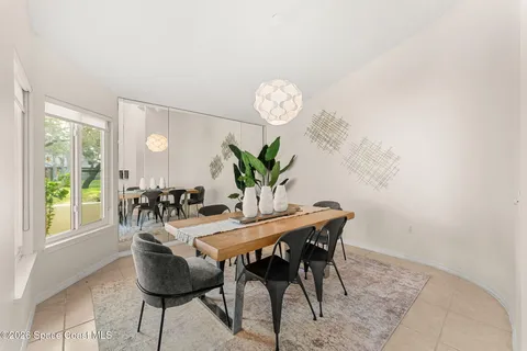 a dining room with furniture and window