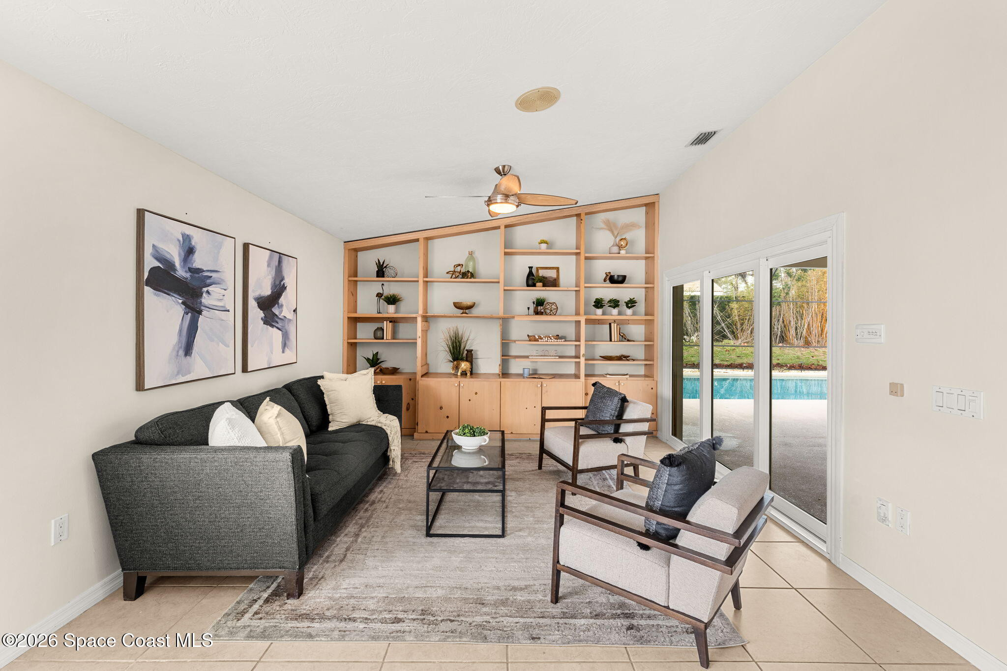 3070 Rio Plumosa North Indialantic, FL 32903 - Photo 8 of 29 a living room with furniture and a floor to ceiling window