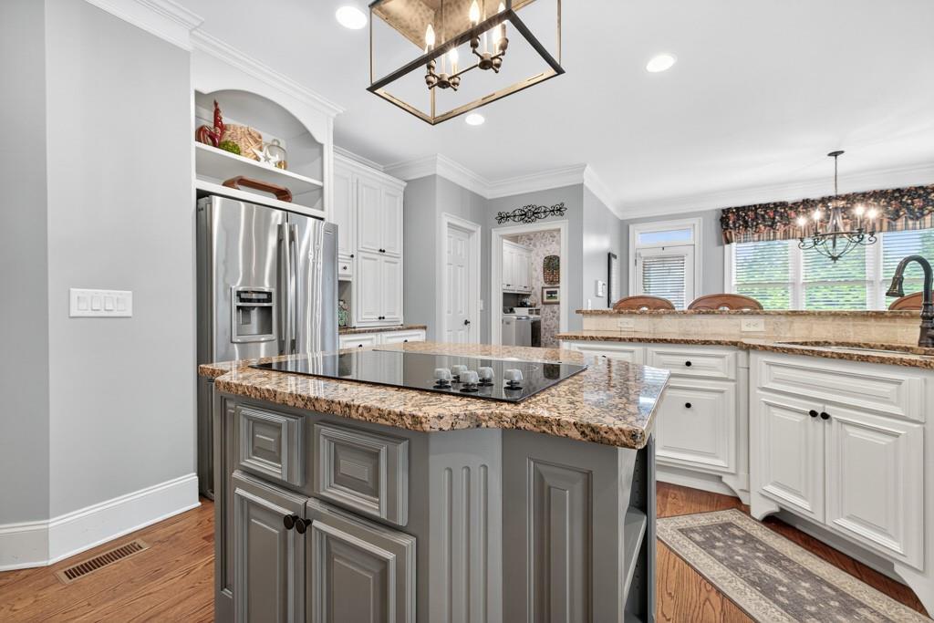 3315 Kylee Dawn Circle Lawrenceville, GA 30045 - Photo 22 of 97 a kitchen with granite countertop a sink stove and refrigerator