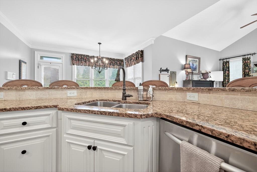 3315 Kylee Dawn Circle Lawrenceville, GA 30045 - Photo 23 of 97 a kitchen with granite countertop a sink and cabinets