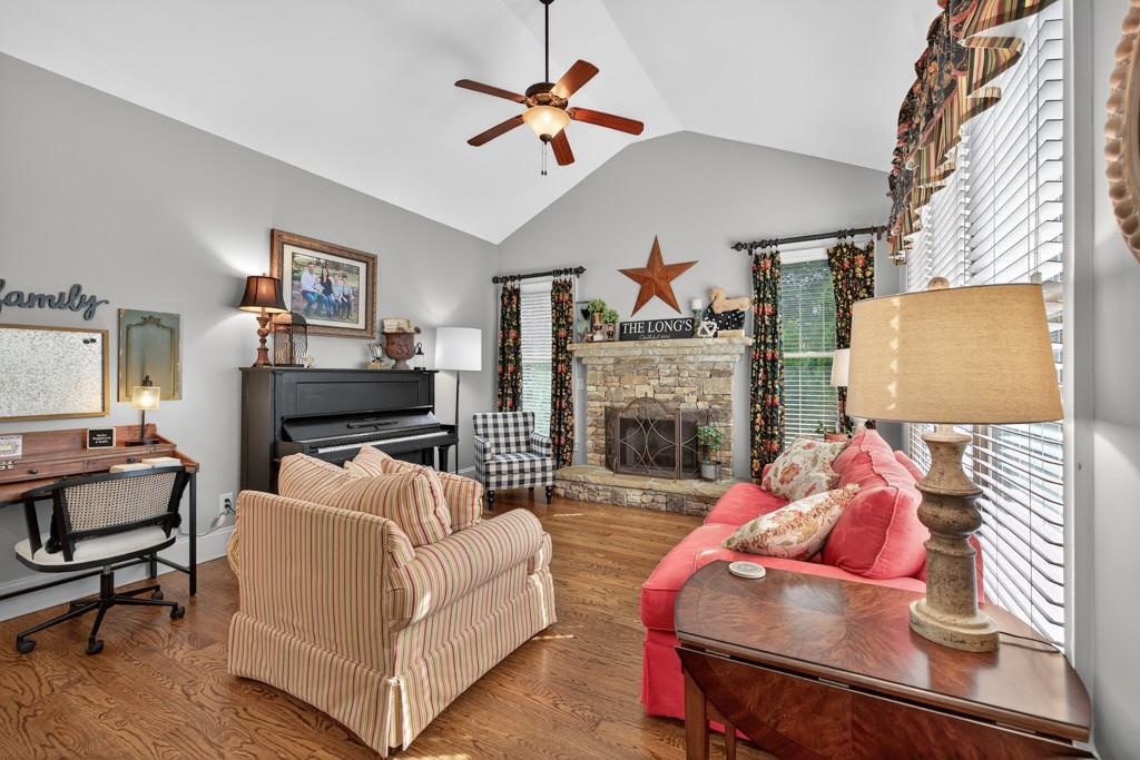 3315 Kylee Dawn Circle Lawrenceville, GA 30045 - Photo 28 of 97 a living room with furniture and a fireplace