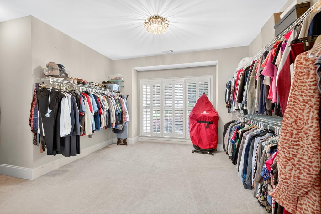 3315 Kylee Dawn Circle Lawrenceville, GA 30045 - Photo 35 of 97 a view of walk in closet with clothes