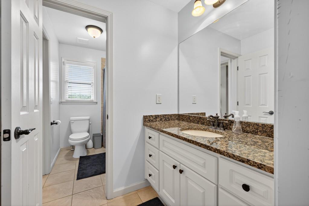 3315 Kylee Dawn Circle Lawrenceville, GA 30045 - Photo 44 of 97 a bathroom with a granite countertop sink and a mirror