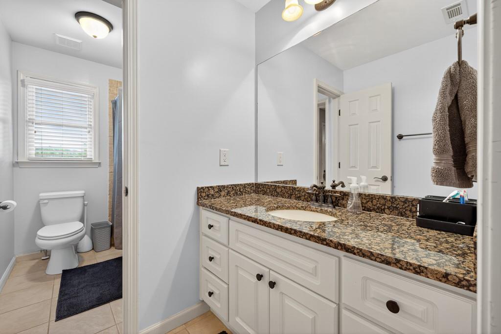3315 Kylee Dawn Circle Lawrenceville, GA 30045 - Photo 45 of 97 a bathroom with a granite countertop sink and a mirror