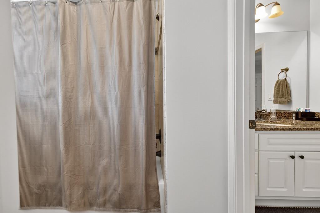 3315 Kylee Dawn Circle Lawrenceville, GA 30045 - Photo 46 of 97 a bathroom with a granite countertop sink and a mirror