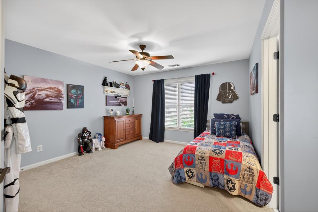 3315 Kylee Dawn Circle Lawrenceville, GA 30045 - Photo 54 of 97 a bedroom with furniture and a bed